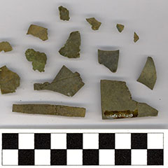 Colour photograph of copper alloy pieces of different shapes. On one, we can see the Borden Code.
